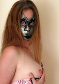an anonymous ginger that wears a mask and shows of her pink pussy