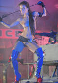 Kristina Walker with gunn in neon lights