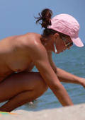 sunny voyeurs view beach babe with pink cap